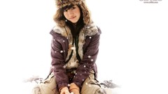 Snow woman white background hats Celebrity sitting coat Actress 