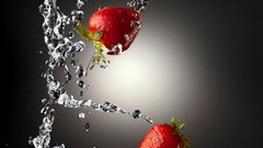 Strawberries water drops slow motion