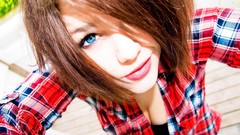 Sun woman close-up brown lips faces shirts smiling blue eyes 