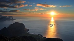 Sunrise Sea water Mountains clouds skies spectacular