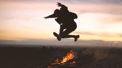 Sunset fire clouds Men silhouettes jumping skyscapes campfire