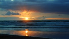 Sunset ocean clouds sun