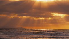 Sunset ocean clouds sun