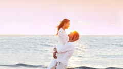 Sunset ocean embrace couple bracelets brunettes white clothes