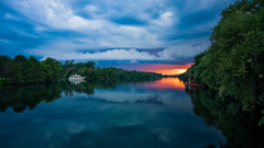 Sunset river clouds boat