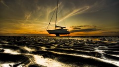 Sunset sand Sailboats vehicles low tide