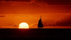 Sunset silhouettes Boats Sea