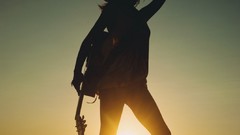 Sunset woman guitars Ana Free