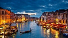 venice cityscape gondolas lights canal building clouds Italy