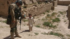 War children ruins soldiers patrol infantry NATO Afghanistan 