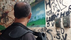 War graffiti weapons Guns police alley slum Rio de Janeiro 