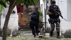 War weapons Guns police alley slum Rio de Janeiro Brazil raid 