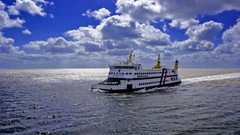Water clouds ships ferry