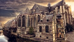 Water old houses sharp skies