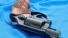 Weapons Guns blue background revolvers Smith and Wesson