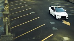 White cars Mitsubishi Lancer Evolution X