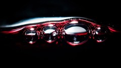 Wine bubbles alcohol black background Red water