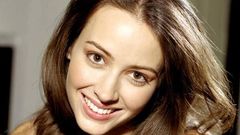 Woman Amy Acker smiling