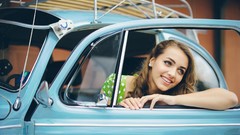 Woman beetle Volkswagen smiling models curly hair Käfer