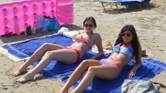 Woman bikini Sisters sunbathing