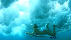 Woman bikini swimming surfboards