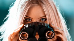 Woman binoculars blondes blue eyes blurred background