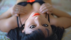 Woman brunettes bra lying down cleavage prostitutes