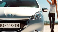 Woman cars Peugeot 208