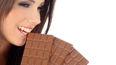 Woman chocolate teeth lips white background faces smiling 