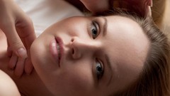 Woman close-up faces long hair blue eyes brunettes lying down 
