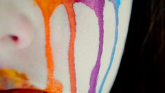 Woman close-up faces streaks face paint