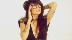 Woman close-up glasses dress white background faces tattoos 