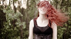 Woman corset closed eyes redheads hair in face pierced lips