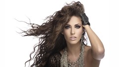 Woman curly hair Simple Background hands on head Anahi jovanna