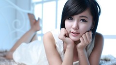 Woman dress asians white dress models black hair lying down 