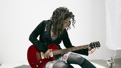 Woman dress socks sitting stockings jackets guitars long hair 