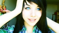 Woman faces blue eyes black hair upscaled plaid shirt