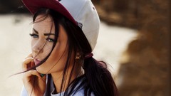 Woman faces blue eyes brunettes pierced nose baseball caps 