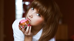 Woman faces cakes muffins