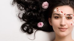 Woman faces charm brunettes flower in hair