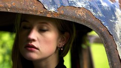 Woman faces closed eyes models inside car