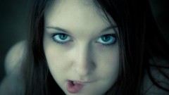 Woman faces green eyes biting lips