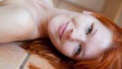 Woman faces smiling blue eyes freckles models lying down mia 
