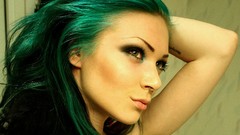 Woman faces tattoos big eyes piercings models green hair 