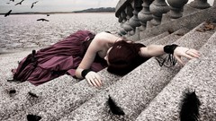 Woman feathers dress baroque stairways