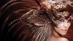 Woman feathers masks head