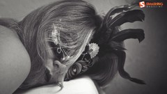 Woman feathers masks masquerade lying down grayscale domino 