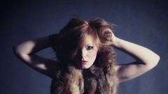 Woman fur blue background models redheads patty arms raised The 