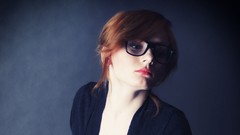 Woman glasses blue background models black dress redheads patty 