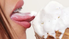 Woman ice cream brunettes licking models braces innuendo 